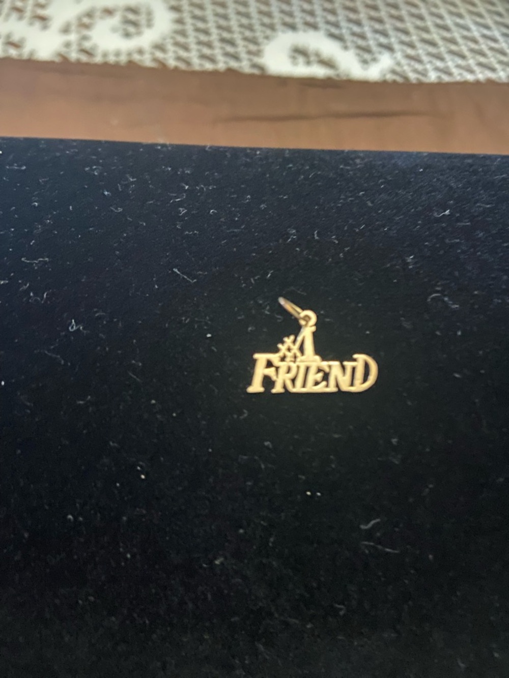 FRIENDS gold-tone "A FRIEND" script charm